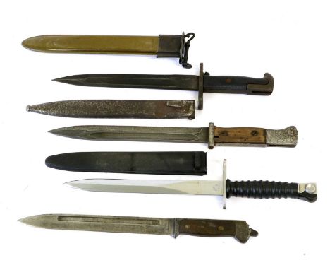 A U.S. Garand M1 Bayonet, one side of the fullered blade stamped S.W.I. with a US flaming grenade, 1943, with ribbed black pl