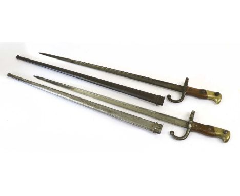 Two French M1874 Gras Bayonets, each with T section steel blade, one engraved Mre d'Armes de St. Etienne 1877 to the back edg