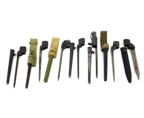 Seven British Bayonets:- No.4 Mk.I with cruciform blade, steel scabbard and webbing frog; two No.4 Mk.II spike bayonets, one 