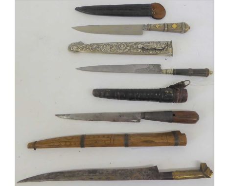 An Argentinian Gaucho Knife, the 18cm steel blade etched with maker's logo and foliage at the ricasso, with ring knopped horn