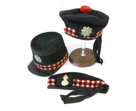 A Highland Light Infantry OR Shako, the dark blue cloth body with black lace upper band and diced lower band, black patent le