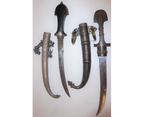 A Late 19th Century Caucasian Jambiya, the 22cm curved steel blade double edged for the last 10cm, the ricasso stamped with a