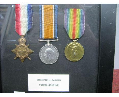 A WWI Trio of Medals, comprising 14/18 Star, War and Victory Medals to 21551 Private H. Barker Yorkshire Light Infantry, moun