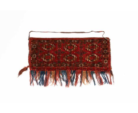 A Tekke torba, West Turkestan, circa 1900, the madder field of six Chuval guls, and further Chemche minor guls, framed by a g