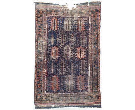 A Timuri Belouch carpet, North East Persia, the indigo field with an all-over design of polychrome stylised cypress trees, fr