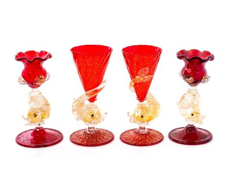 A pair of Venetian Murano Salviati cranberry coloured glass candlesticks with dolphin stems, 12cm high, and a pair of Venetia