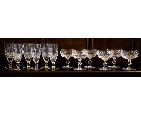 A group of 12 late 20th century Irish Waterford cut crystal champagne flutes and champagne cups in "Colleen" pattern. Etched 