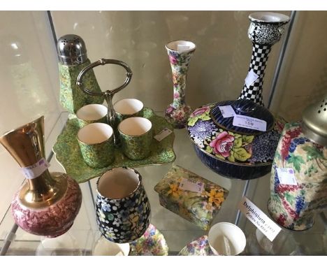 A group of mid century Chintz ware pieces, some Royal Winton examples, bud vases, handled stand with 4 egg cups, sugar sifter