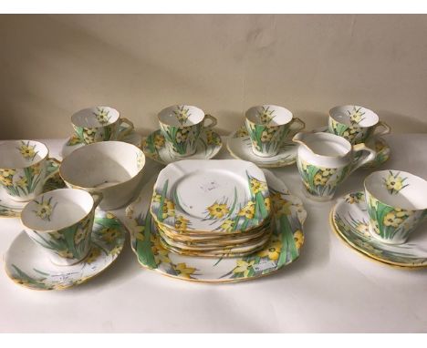 A mid century Bell china (England) tea service including sandwich plate, milk jug and sugar bowl with narcissus design.Condit