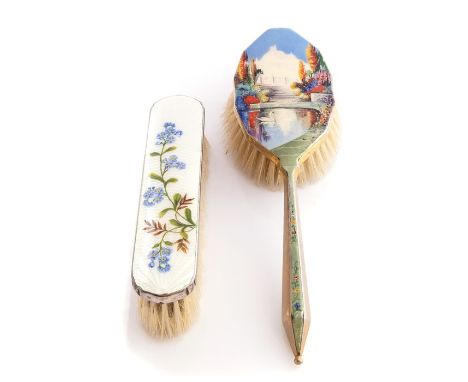 A pair of plated and enamel dressing table brushes, one with floral detail, other with lake scene and swan to the foreground&