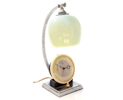 A 1950s Metamec (British) electrical chrome lamp and clock with glass shade