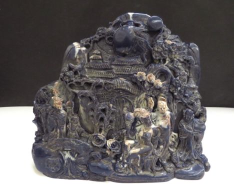 A Chinese boulder carving depicting a mountain scene, 15cm tall, 18cm wide 