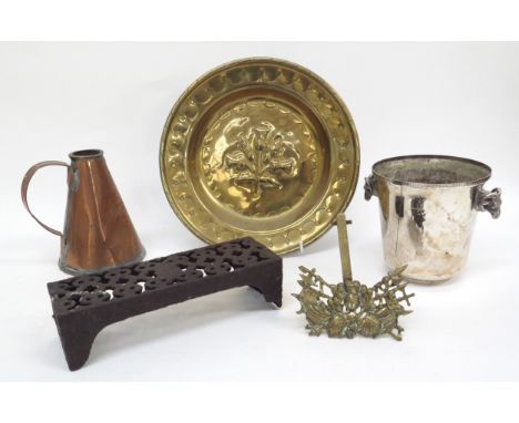 A brass dish with central embossed thistle, pint vessel armorial stand, 19th Century cast iron grate and a silver plate rams 