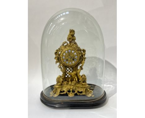 A mid 19th Century French Raingo Freres ormolu and gilt brass mantel clock, relief moulded Rococo form, the gilt embossed 3” 
