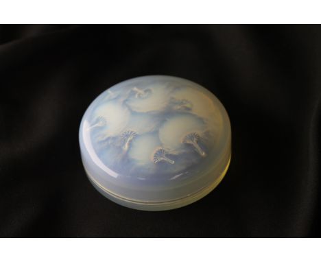 A Rene Lalique (1860-1945) glass 'Houppes' powder box and cover with opalescent design, model 29, designed c1921. Moulded mar