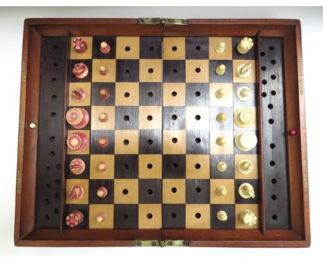 A Jacques London mahogany cased travelling chess set with stained red bone and natural pieces, gilt stamped IN STATU QUO CHES
