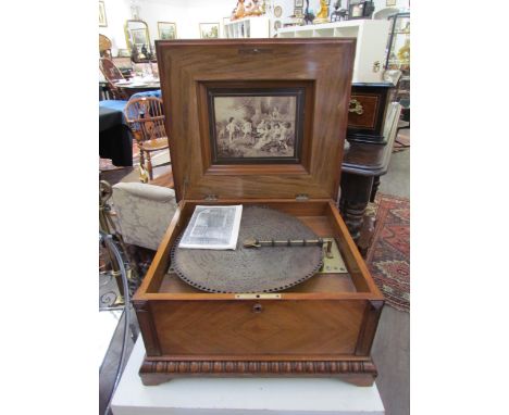 A 19th Century walnut cased table Polyphon, marquetry inlaid top, with approximately 25 15.5'' discs 