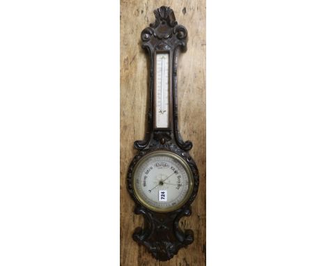 An Edwardian walnut aneroid barometer 75cm