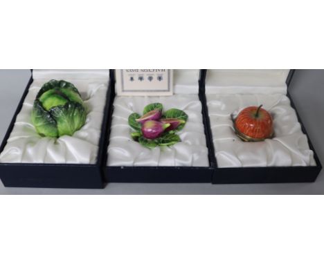 Seven Halcyon Days enamel bonbonnieres modelled as fruit and vegetables; pineapple, apple, asparagus bunch, figs, cabbage, re