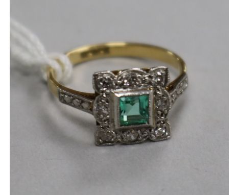 A mid 20th century 18ct gold, emerald and diamond set tablet ring, size M.