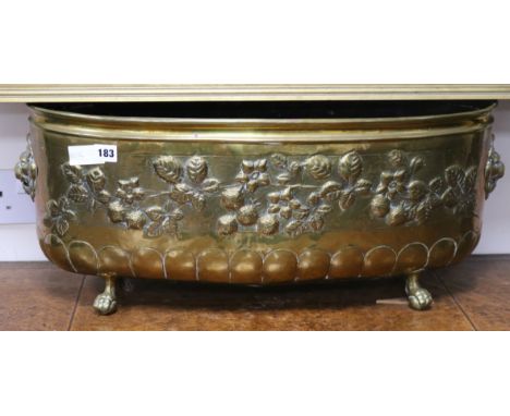 An Edwardian embossed brass planter width 68cm