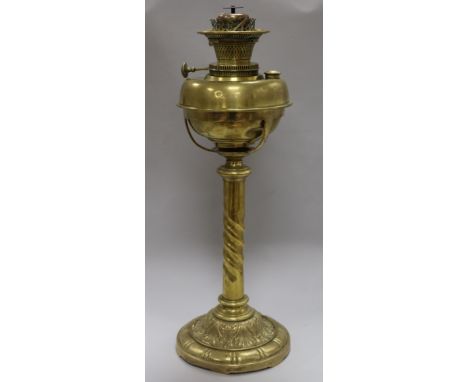 An Edwardian brass oil lamp with later shade