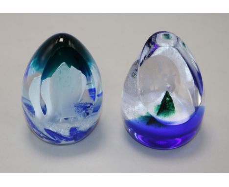 Two Caithness limited edition glass paperweights, Christmas Carol and Beachy Head Lighthouse, with boxes