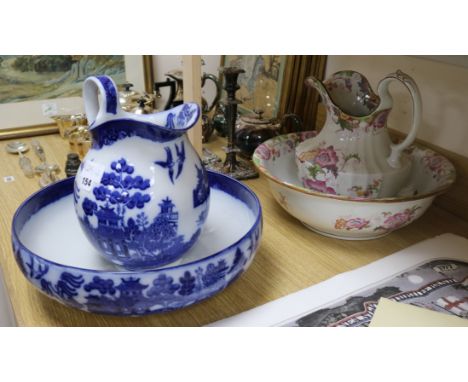 A Doulton Burslem Willow pattern wash jug and basin and a similar Cauldon wash jug and basin