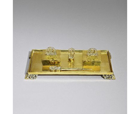 Karl HagenauerFive-piece desk set, circa 1925Polished brass, comprising: a rectangular pen tray, two inkwells with hinged lid