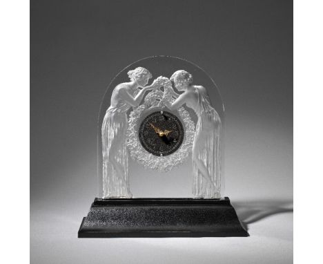 René Lalique'Deux Figurines' mantel clock, designed 1926Clear glass, moulded and frosted, on illuminated metal pedestal mount