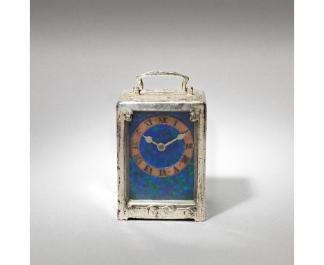 Liberty & Co.'Tudric' cased carriage clock, model no. 0721, circa 1905Pewter, enamel, copper and glass.13.8 cm highUnderside 