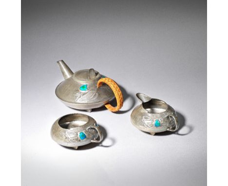 Archibald Knox'Tudric' three-piece teaset, model no. 0231, circa 1905Pewter, enamel, wicker. Comprising: Teapot, milk and sug