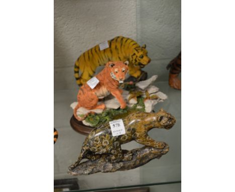 A carved hardstone model of a tiger and two others.