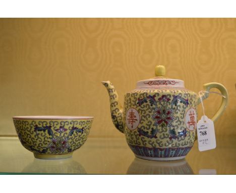 A Chinese Famille Jaune teapot and bowl.