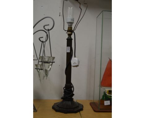 A bronze table lamp.