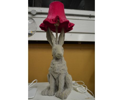 A novelty table lamp in the form of a hare.