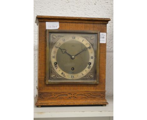 An Elliott oak cased mantle clock.
