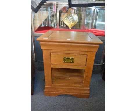 A modern oak single drawer lamp table and another table.