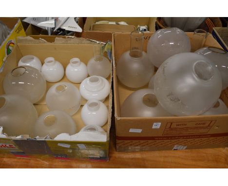 A quantity of glass oil lamp shades.