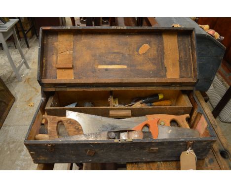 A carpenter's tool box containing various tools.