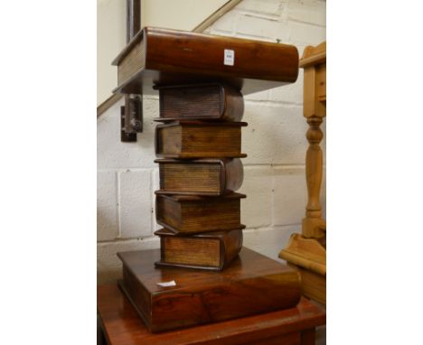 A novelty lamp table modelled as a stack of books.