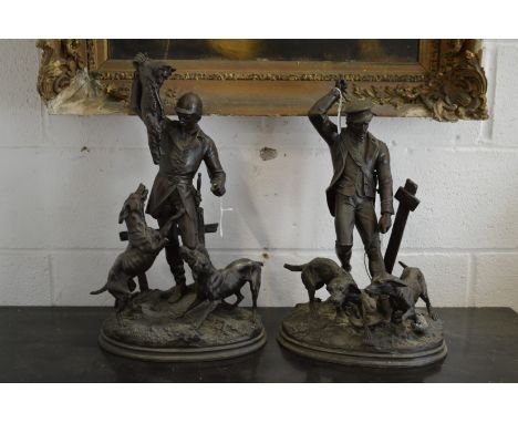 A good pair of spelter hunting figures, one with a huntsman with fox and hounds, the other with a dog handler.