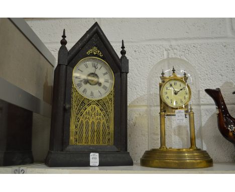 A mantle clock and an anniversary style clock, lacking pendulum.