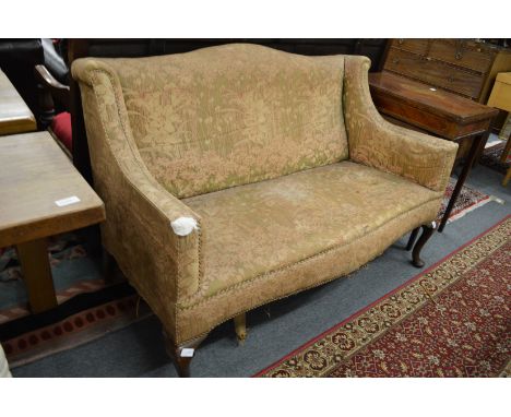 An Edwardian two-seater settee upholstered in an Art Nouveau design fabric.