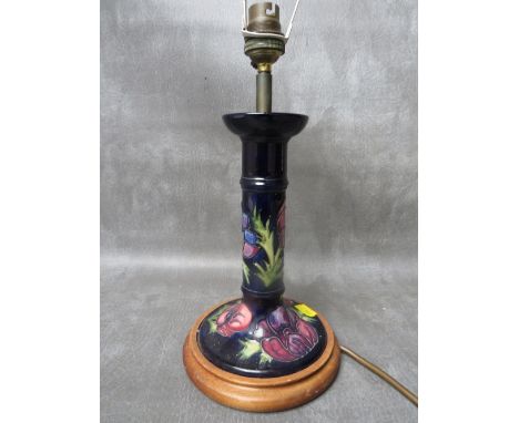 A MOORCROFT POTTERY CANDLESTICK CONVERTED TO A LAMP, floral pattern, H 31 cm (inc. fitting)
