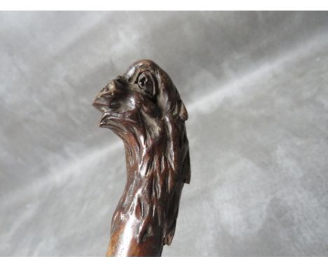 A 19TH CENTURY SWORDSTICK, with carved animal head to the handle, overall L 81 cm, blade L 60 cm