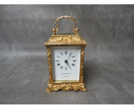 A CHARLES BEYFUS 20TH CENTURY CARRIAGE CLOCK, having an eight day movement housed in an ornate Rococo cast brass case, retail
