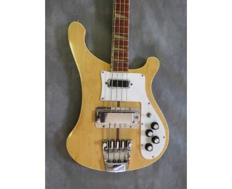 A VINTAGE RICKENBACKER 4001 MAPLEGLO BASS GUITAR, serial No. QA135, dated January 1977, with shulder strap, in a hard travel 