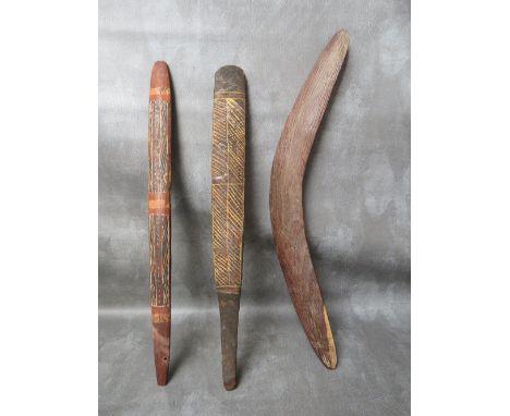 TWO VINTAGE ABORIGINAL BULL ROARERS, with painted decoration, L 51 cm, together with a stone carved boomerang (3)
