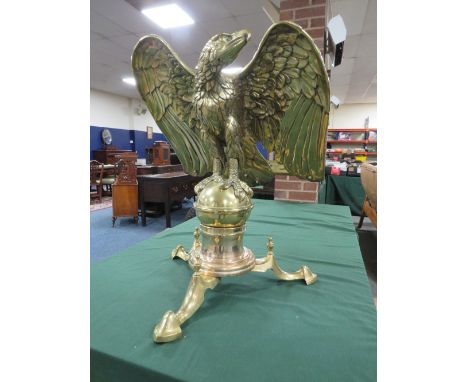 A BRASS CHURCH EAGLE LECTERN, the eagle with out swept wings atop a circular sphere, mounted on a later three legged stand, d
